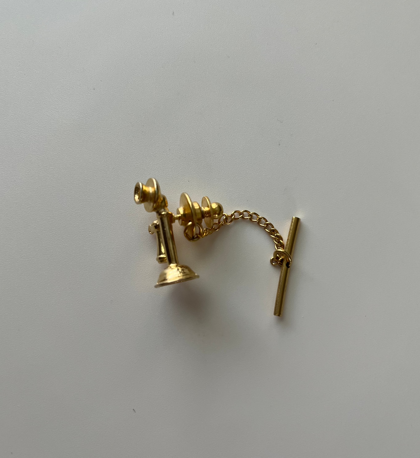 Rugin Candlestick Phone Tie Tack